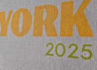 Text 'NEW YORK 2025' on a gray background with green accents