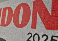 Text 'LONDON 2025' on a fabric background