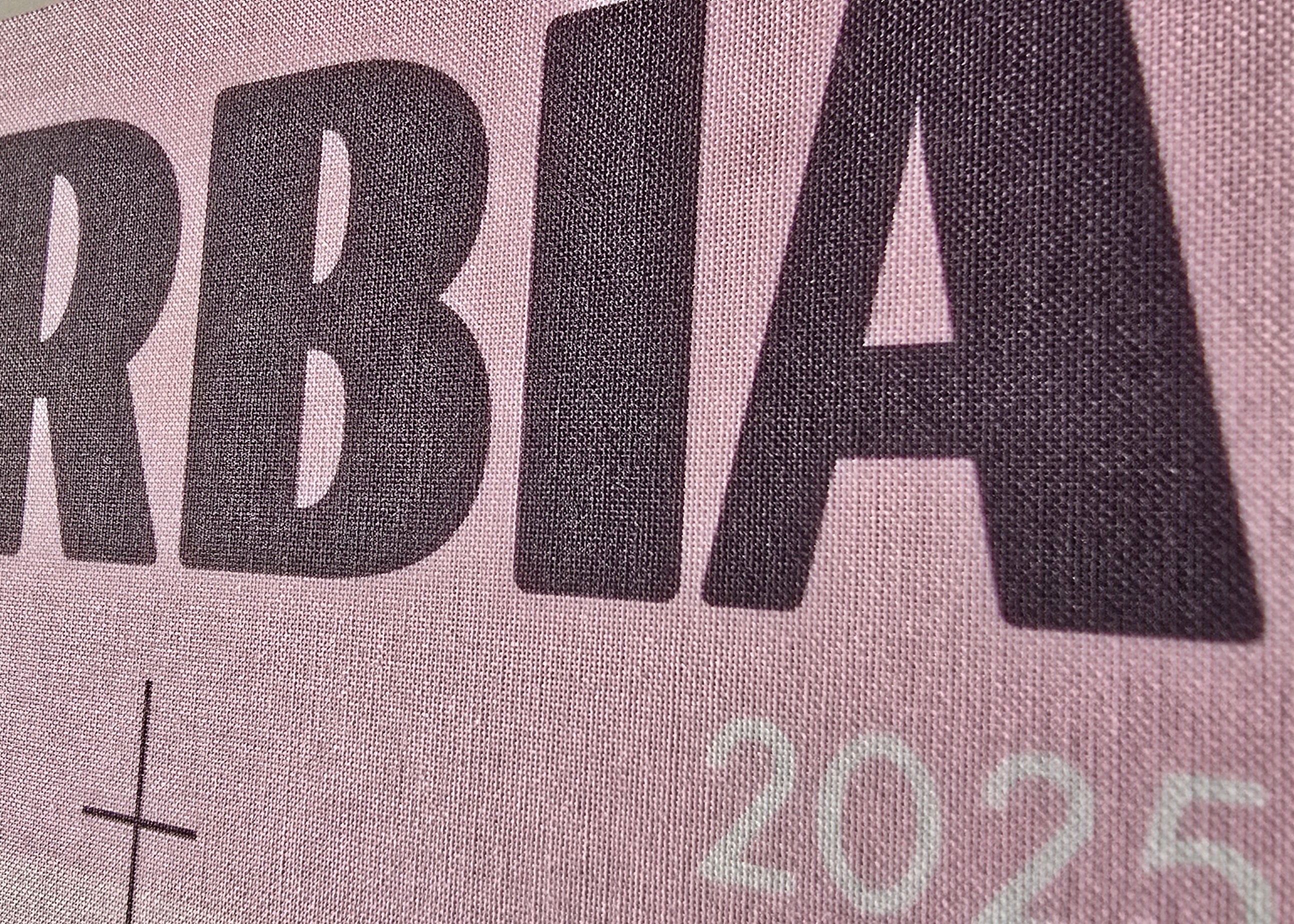 Text 'SERBIA 2025' printed on a fabric background