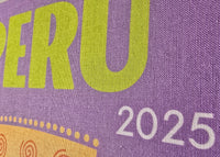 Purple book or notebook with 'PERU 2025' text on a purple background