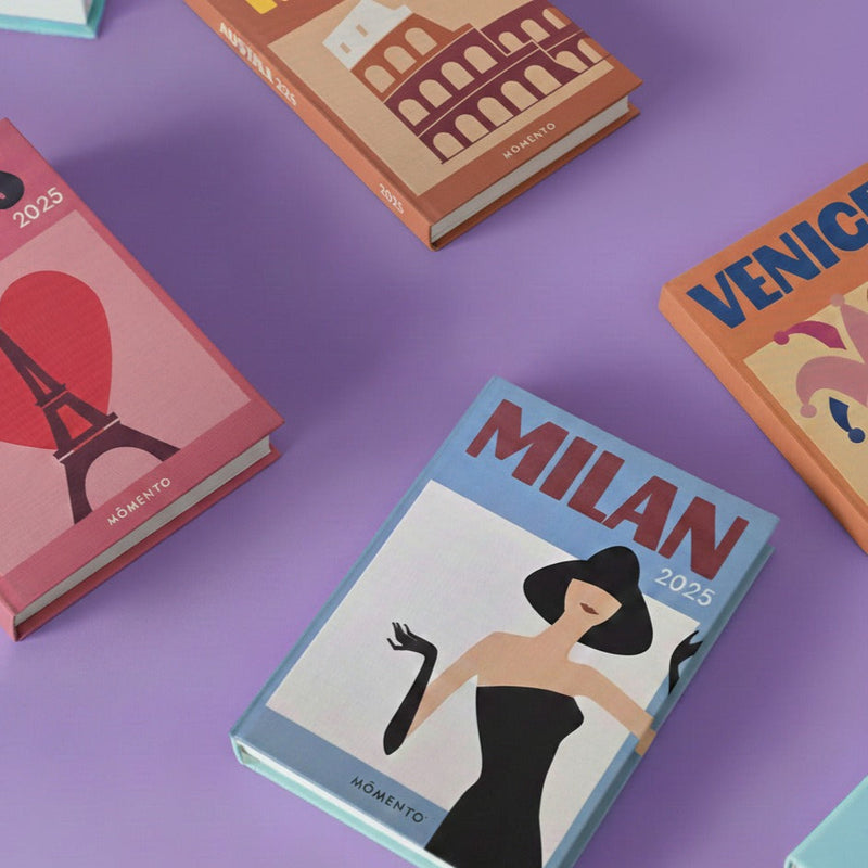 Collection of travel-themed books on a purple background